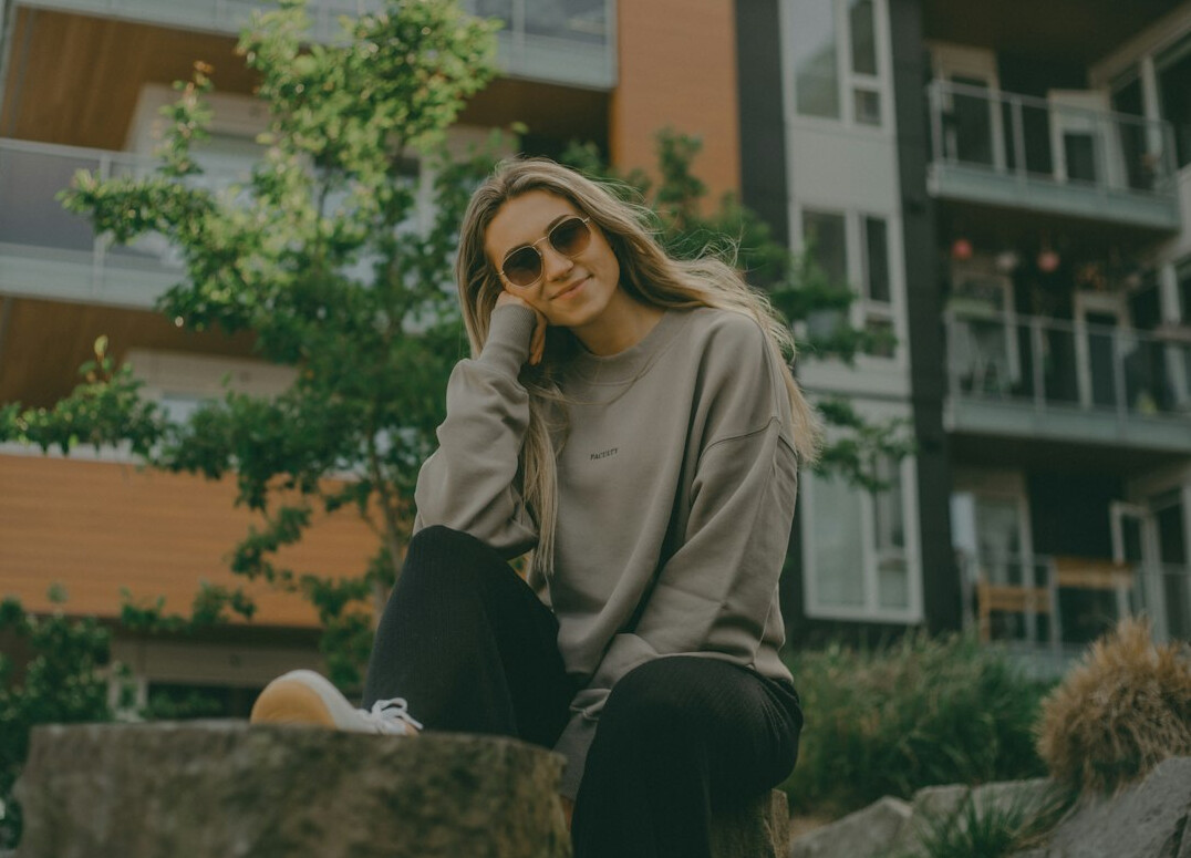 Smiling woman in casual clothes outdoors